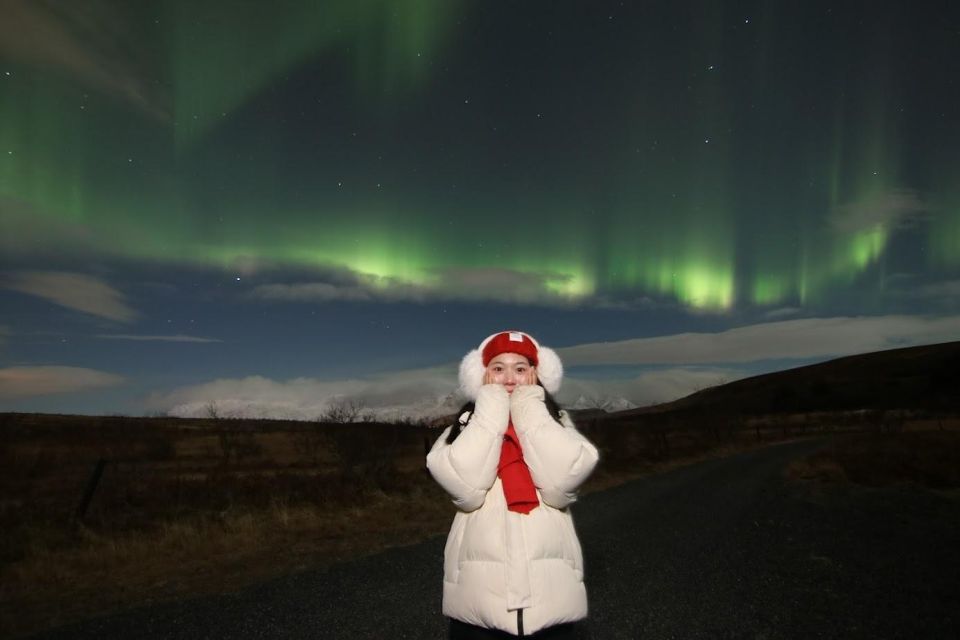 From Reykjavík: Northern Lights Tour with Hot Cocoa & Photos - Language, pace, and how the night is run