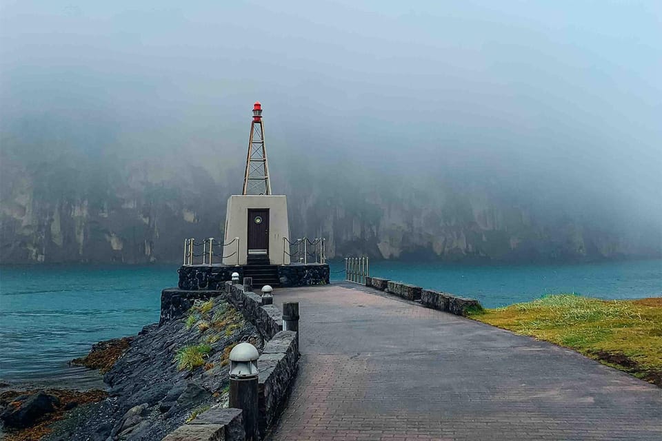 From Reykjavik: Puffin and Volcano Tour in Westman Islands - Skansinn The Fort: Viking Wood Church, Lighthouse, and Cliff Views