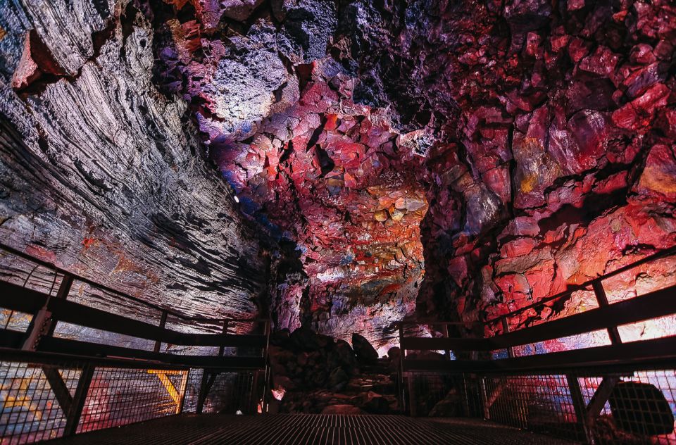 From Reykjavik: Raufarhólshellir Lava Tunnel by Bus - Entering Raufarhólshellir: columns of light and mineral color
