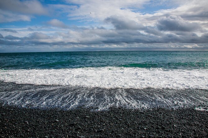 Full Day South Coast to Vík - Guided Tour - Reynisfjara black sand, basalt columns, and Dyrhólaey views