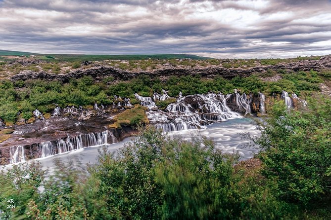 Icelandic Sagas and Glacier Cave Private Tour from Reykjavik - Hot springs and lava waterfalls: Deildartunguhver and Hraunfossar