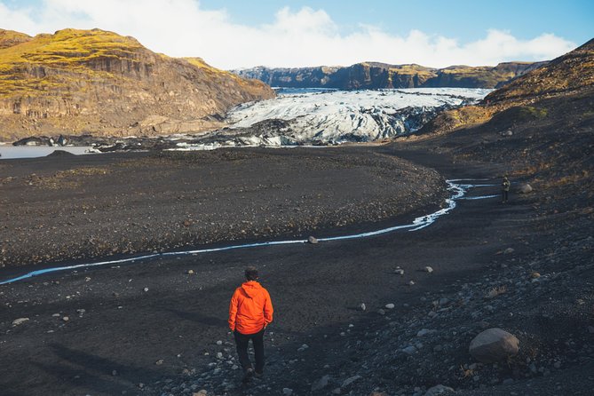 South Coast Day Tour Black Sand Beach & Waterfalls from Reykjavik - Solheimajokull glacier: touching the ice at the edge